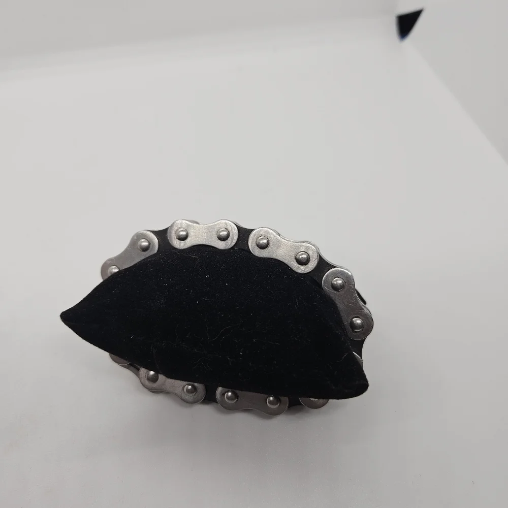 silver tone and black bicycle chain style bracelet